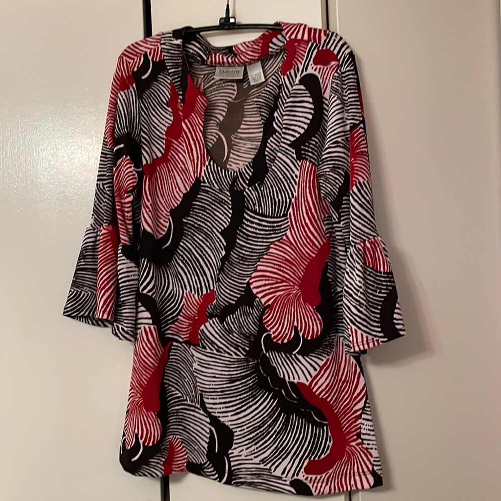 Chicos new without tags very cute top. Bell sleeves 95% polyester 5% spandex.